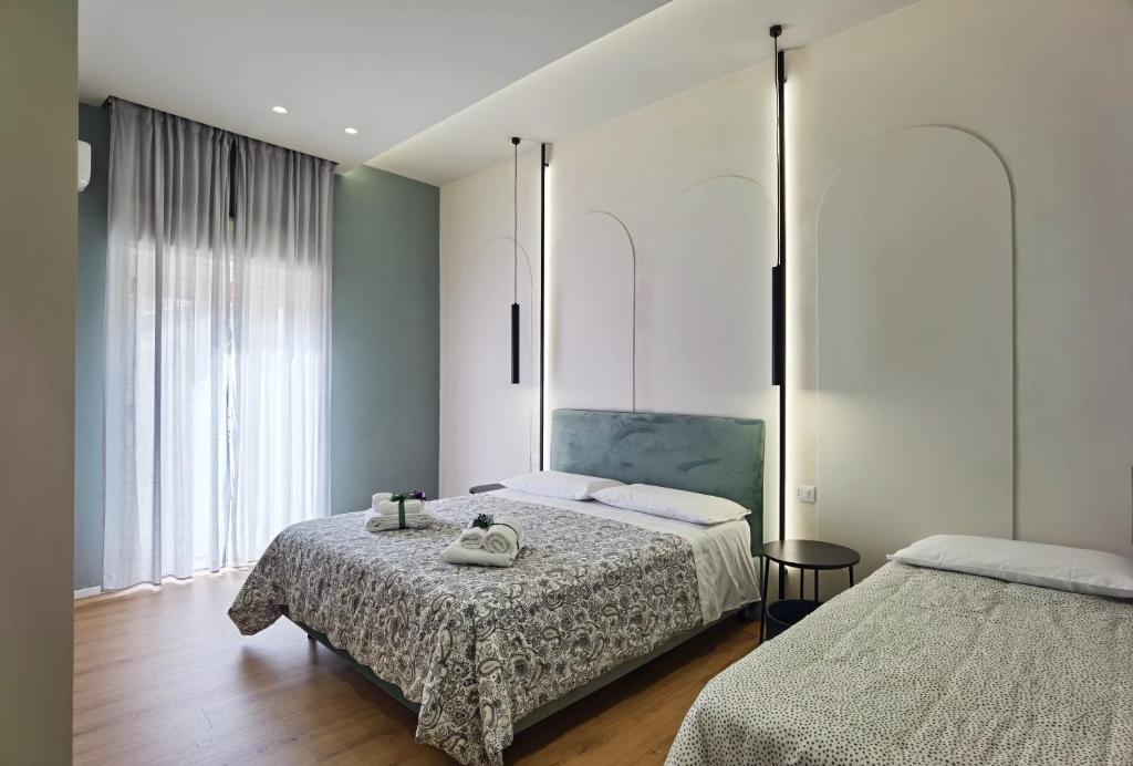 Postel nebo postele na pokoji v ubytování Tersikore bedrooms