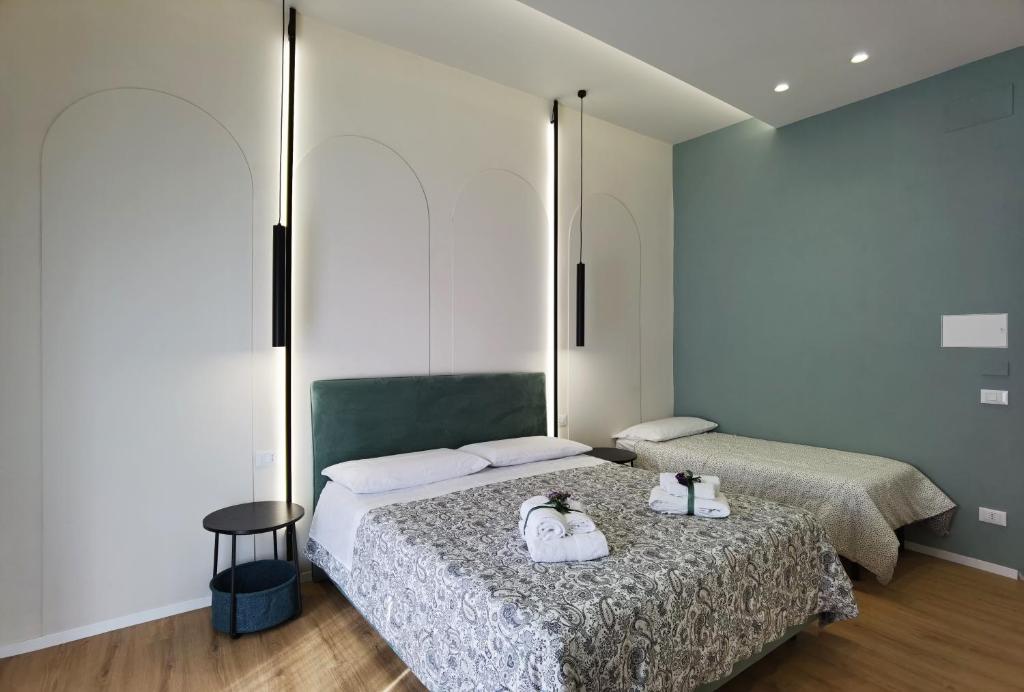 Postel nebo postele na pokoji v ubytování Tersikore bedrooms