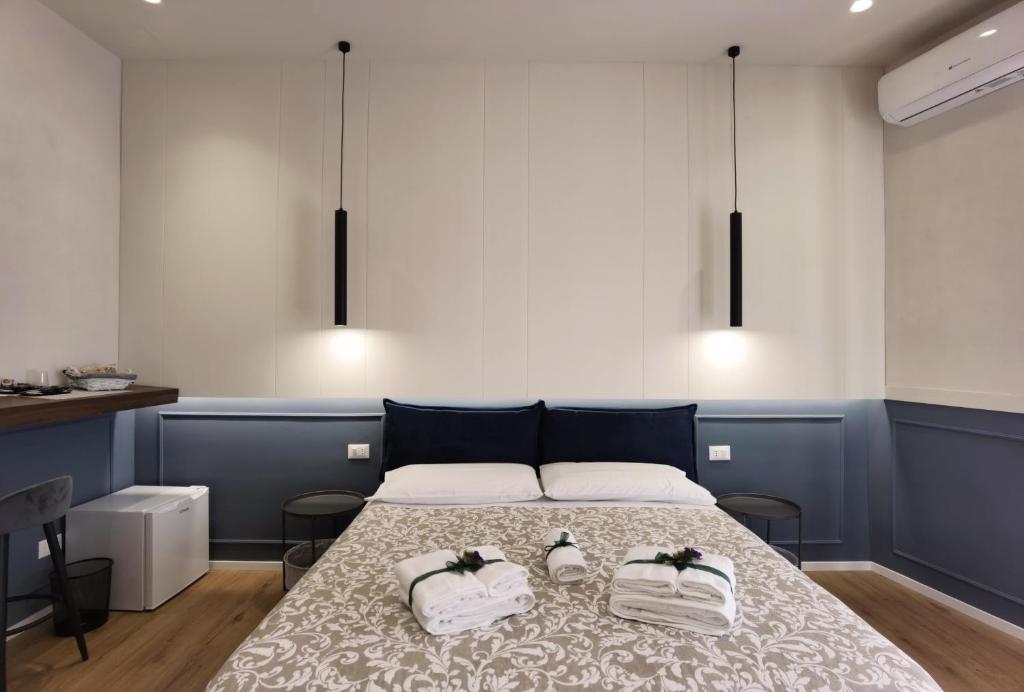 Postel nebo postele na pokoji v ubytování Tersikore bedrooms