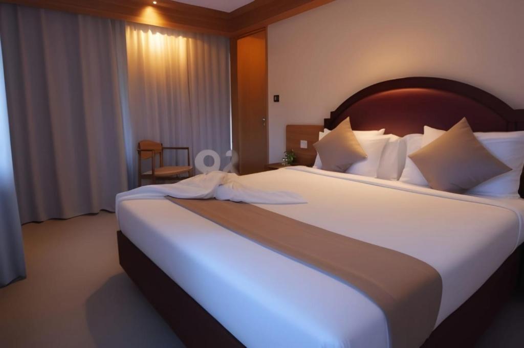 Postel nebo postele na pokoji v ubytování Hack Patong Beach Hotel