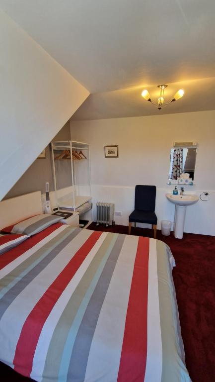 Postel nebo postele na pokoji v ubytování Mackenzie Guest house