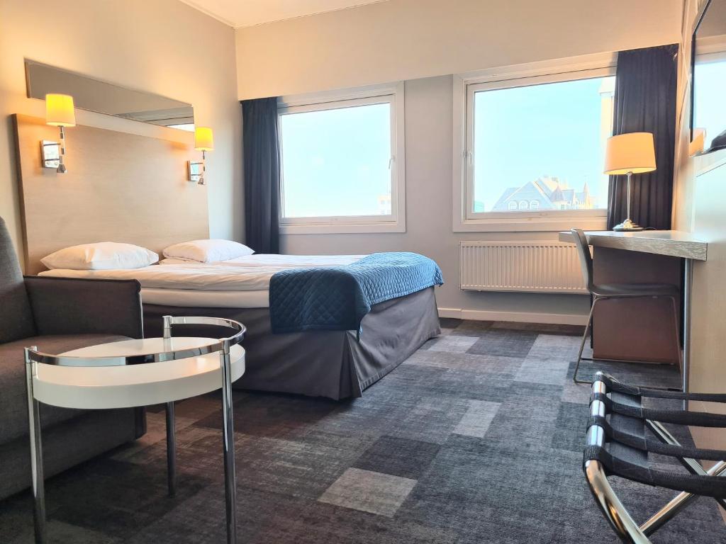 Postel nebo postele na pokoji v ubytování City Living Sentrum Hotel