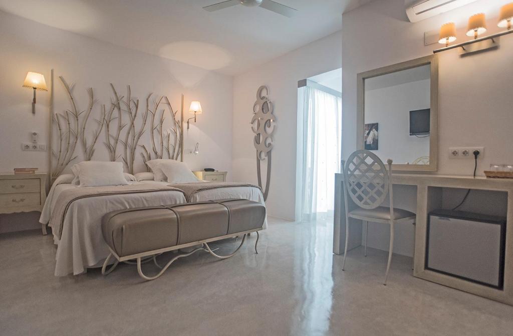 Postel nebo postele na pokoji v ubytování Hotel Sa Volta