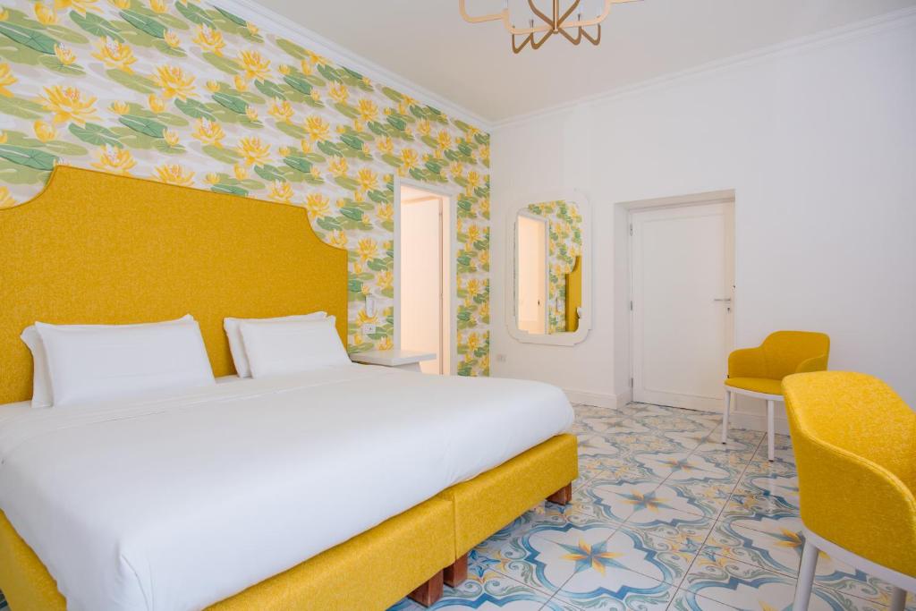 Katil atau katil-katil dalam bilik di Relais Correale Rooms & Garden