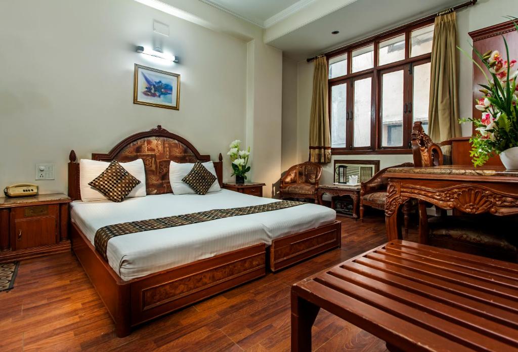 Postel nebo postele na pokoji v ubytování Hotel Sunstar Residency