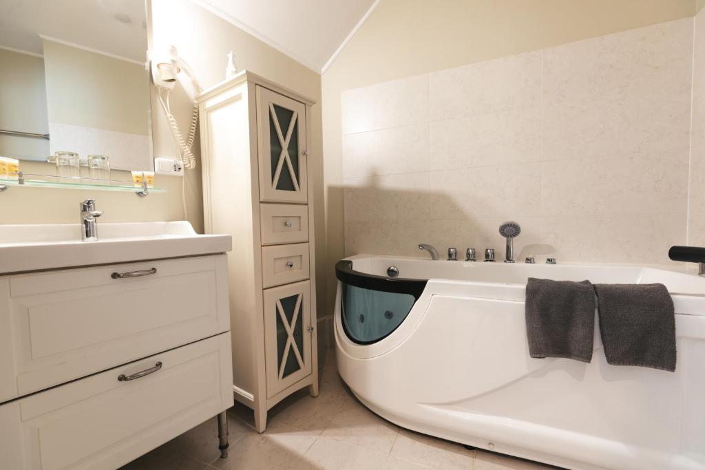 Koupelna v ubytování Forums Boutique Hotel
