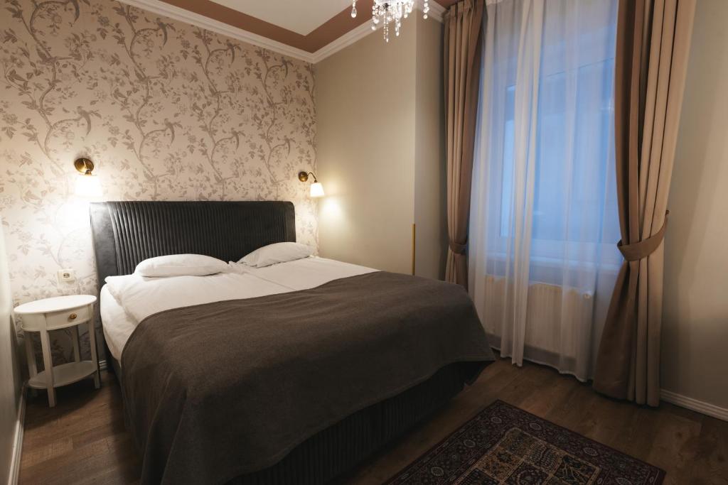 Postel nebo postele na pokoji v ubytování Forums Boutique Hotel