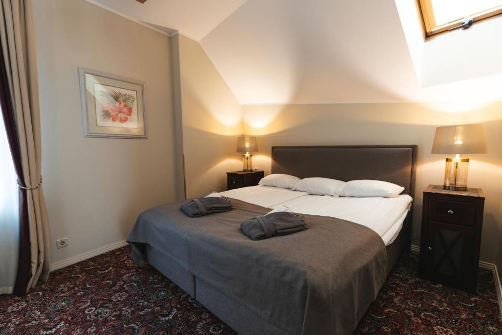 Postel nebo postele na pokoji v ubytování Forums Boutique Hotel