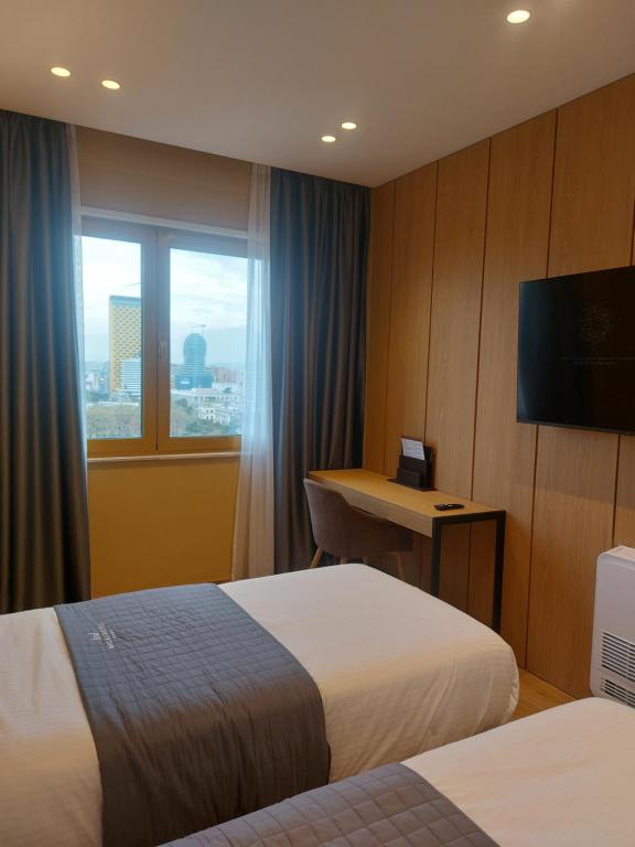 Una cama o camas en una habitación de Mulaj Hotel