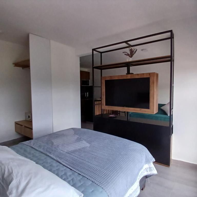 Letto o letti in una camera di Apartaestudio Moderno