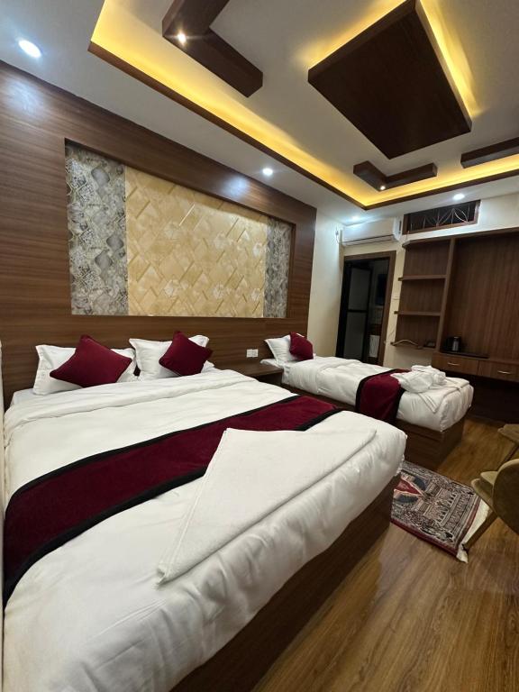 Postel nebo postele na pokoji v ubytování Lazimpat Boutique Hotel
