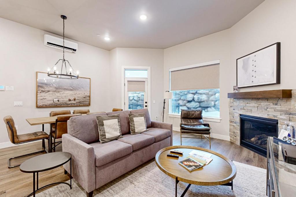 a living room with a couch and a fireplace at 304 - Black Rock Mountain Resort in Heber City