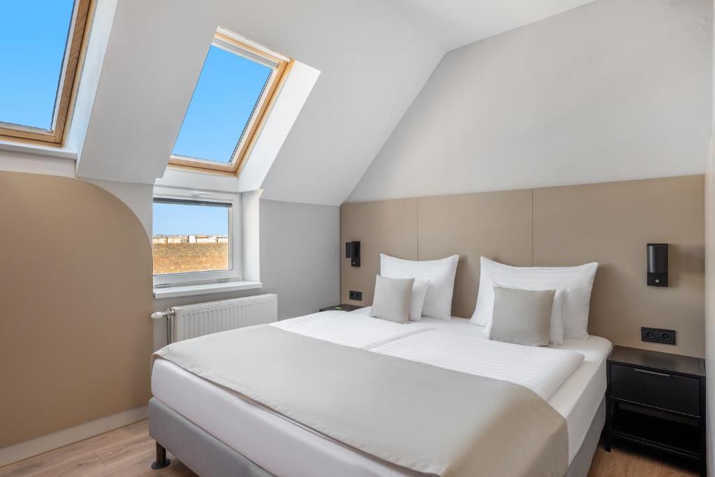 Postel nebo postele na pokoji v ubytování Florin Apart Hotel