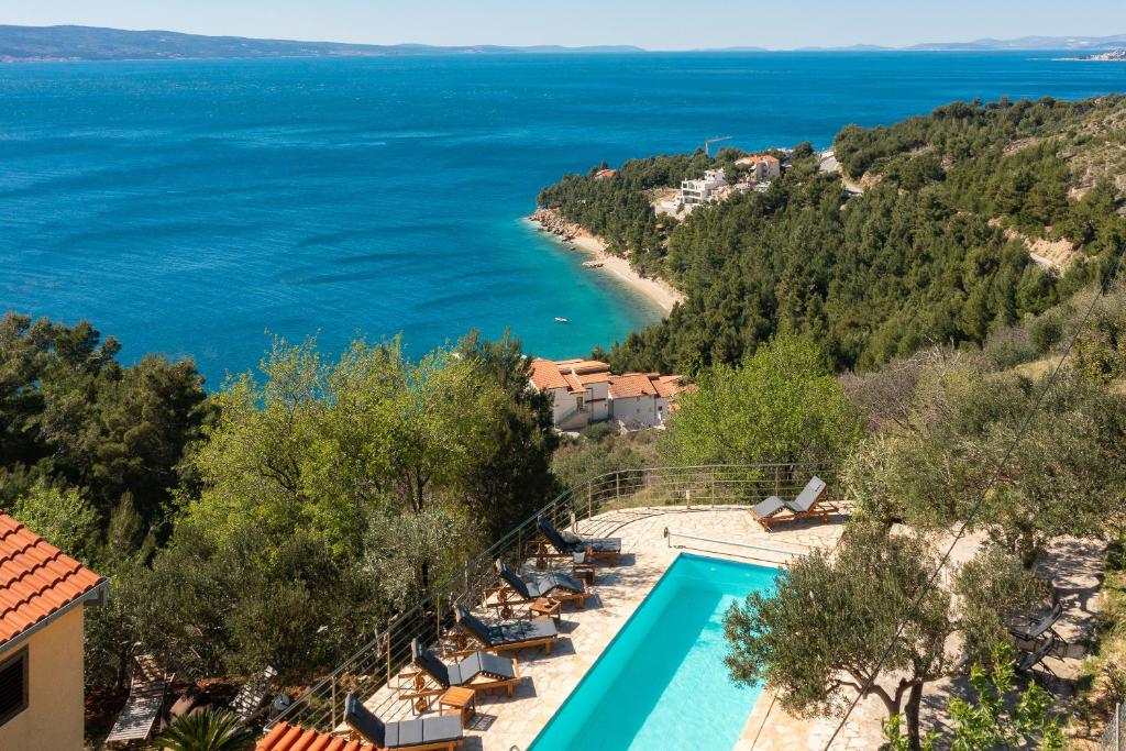 a view of the ocean from a resort with a swimming pool at Casa Malinas in Stanići