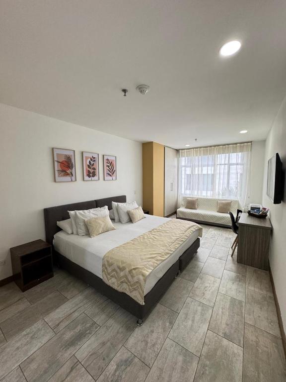 Postel nebo postele na pokoji v ubytování Hotel Rosales Suite