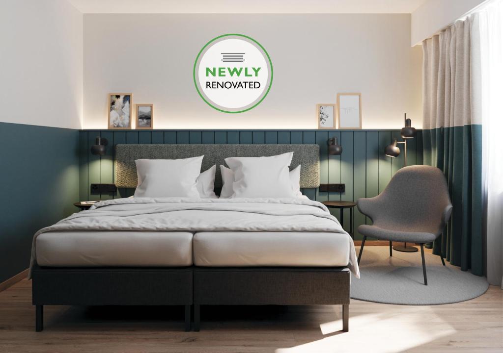 Postel nebo postele na pokoji v ubytování City Hotel Biel Bienne Free Parking