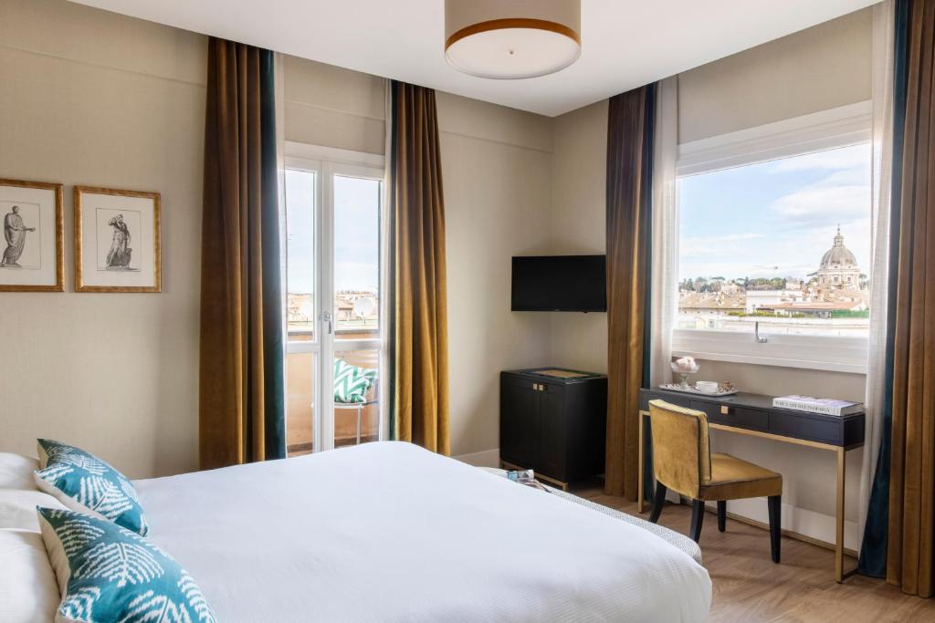 Postel nebo postele na pokoji v ubytování HOTEL ADRIANO Rooftop