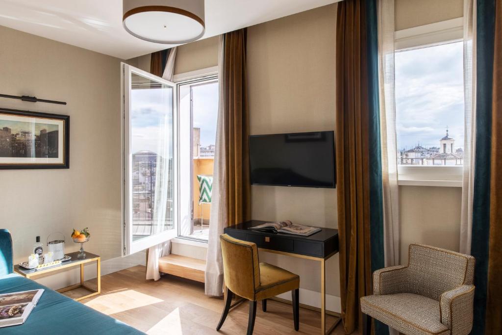 TV a/nebo společenská místnost v ubytování HOTEL ADRIANO Rooftop