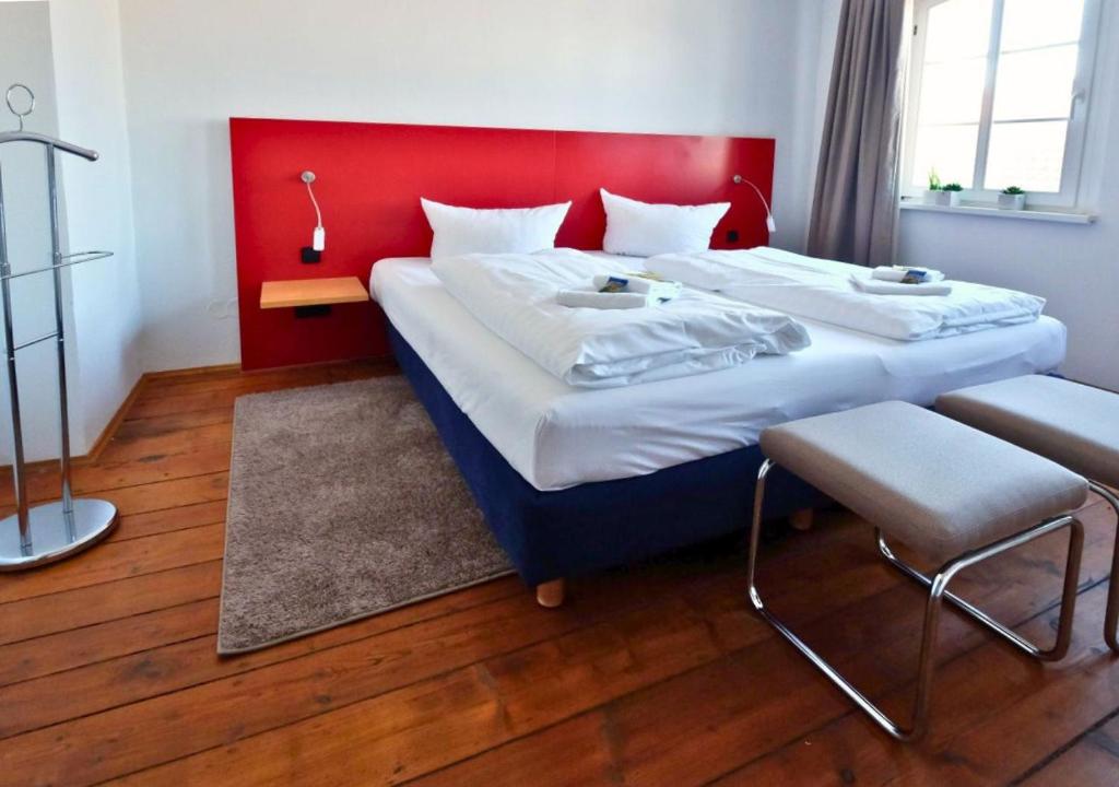 Postel nebo postele na pokoji v ubytování Resort Schloss Auerstedt