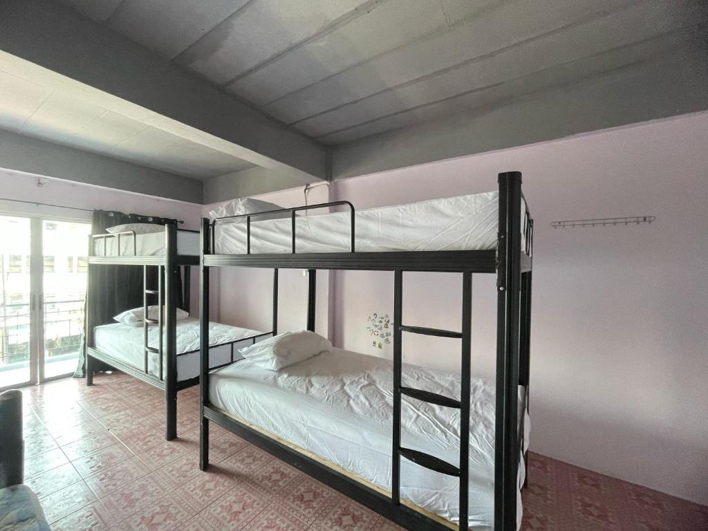 Ένα ή περισσότερα κρεβάτια σε δωμάτιο στο Bed & Breakfast Pattaya