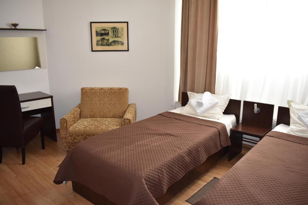 Postel nebo postele na pokoji v ubytování Garni Hotel Lion