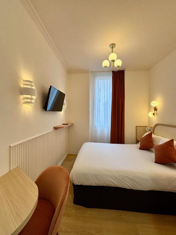 Postel nebo postele na pokoji v ubytování Hotel Boréal Nice
