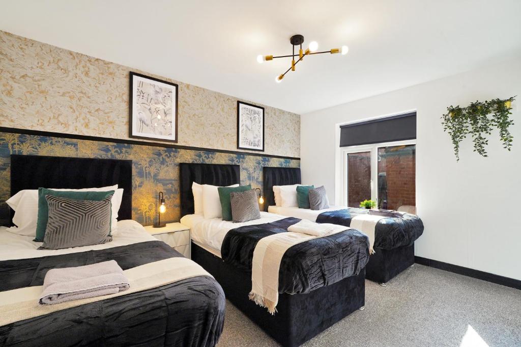 Ένα ή περισσότερα κρεβάτια σε δωμάτιο στο Stylish Yorkshire Apartment - Sleeps 5