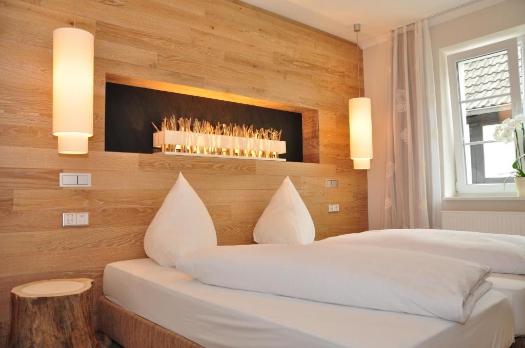 Postel nebo postele na pokoji v ubytování Hotel Sauerländer Hof