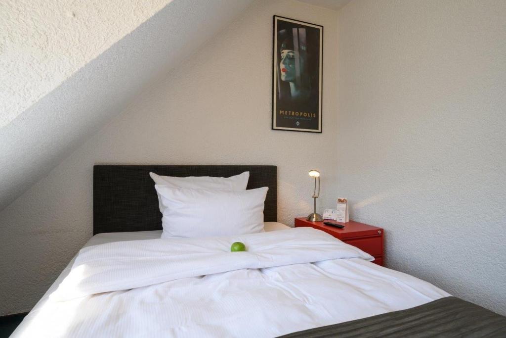 Postel nebo postele na pokoji v ubytování Hotel Heymann