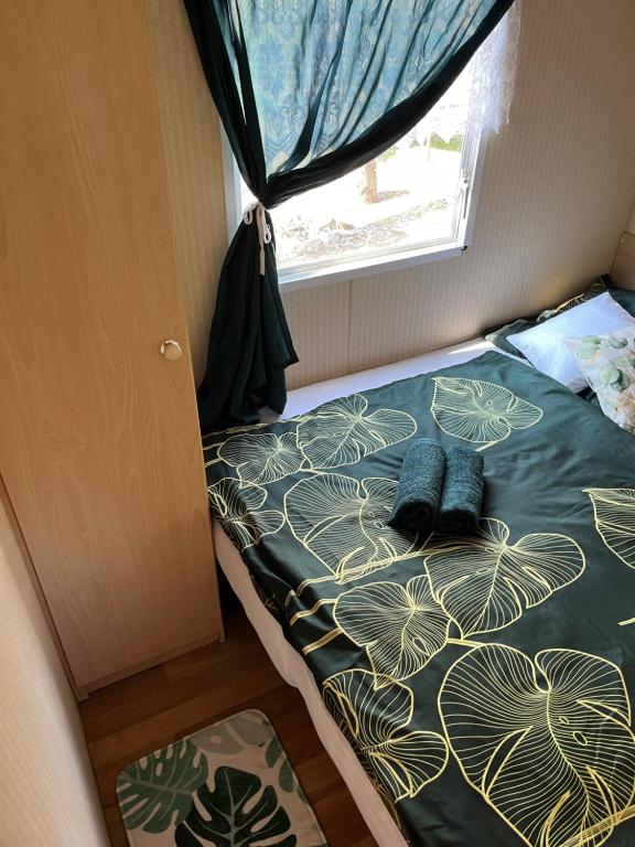 Postel nebo postele na pokoji v ubytování Mobilheimy Fofo
