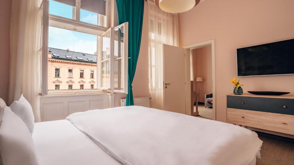 Postel nebo postele na pokoji v ubytování Boutique Hotel Klarov