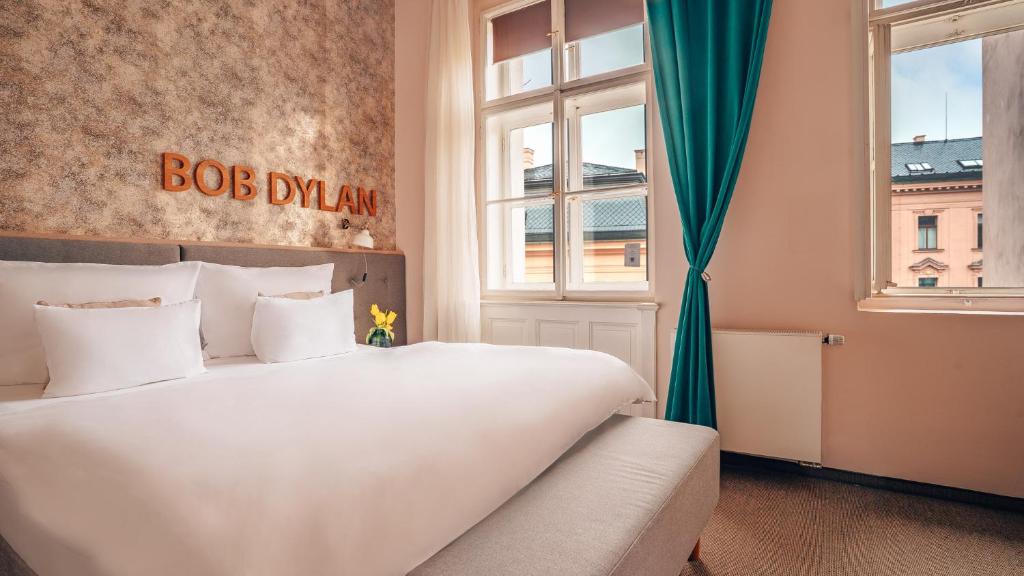 Postel nebo postele na pokoji v ubytování Boutique Hotel Klarov