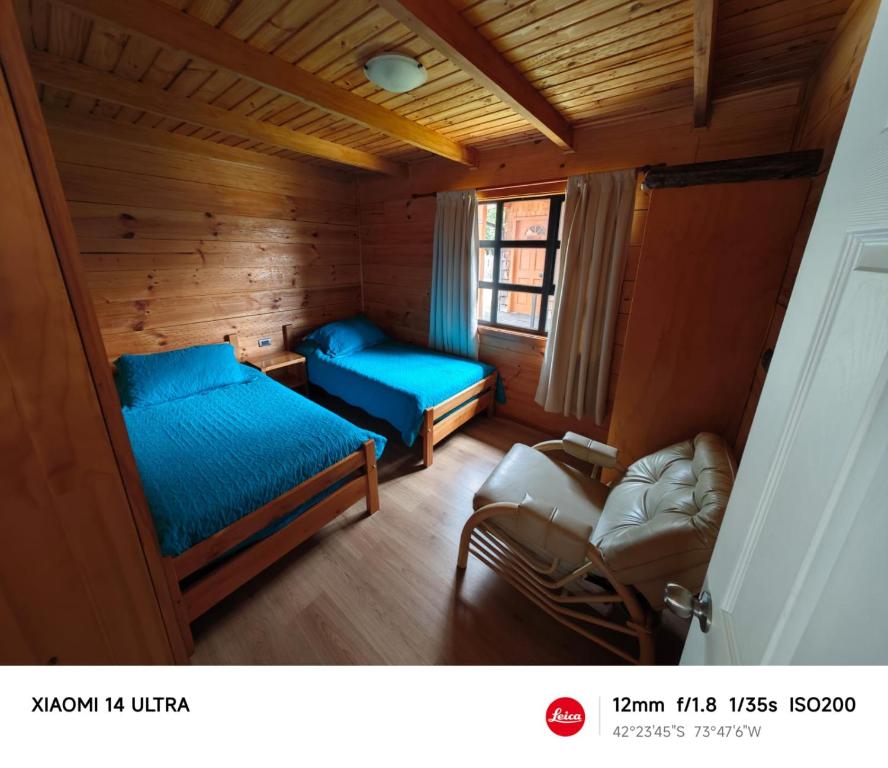 Postel nebo postele na pokoji v ubytování HelChiloé Cabañas
