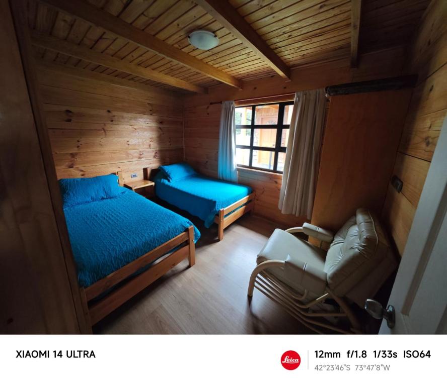 Postel nebo postele na pokoji v ubytování HelChiloé Cabañas