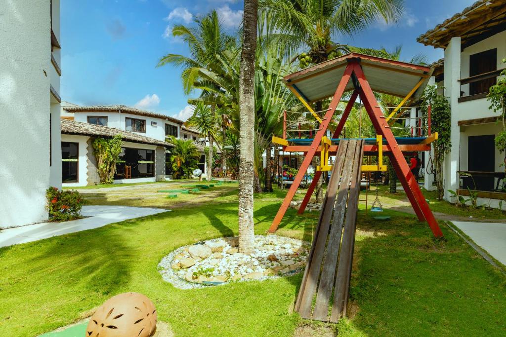 Um jardim no exterior de Arraial do Sol Beach Hotel