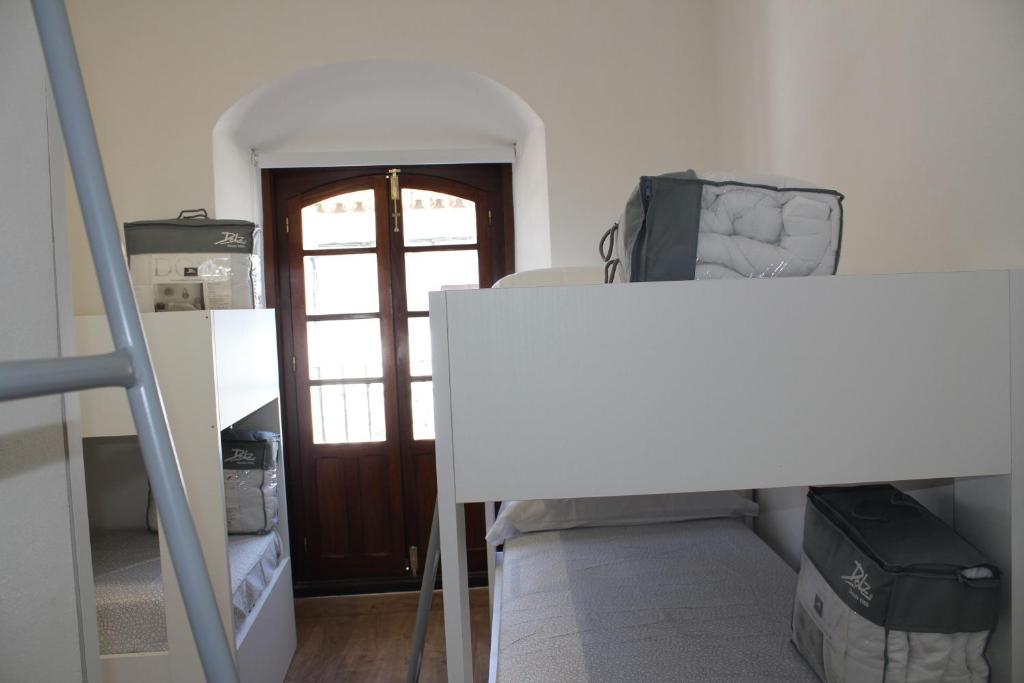 Postel nebo postele na pokoji v ubytování Pórtico del Azahín