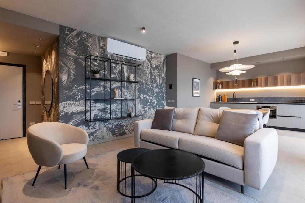 a living room with a couch and a table at Stemor Visionary Apartments in Desenzano del Garda