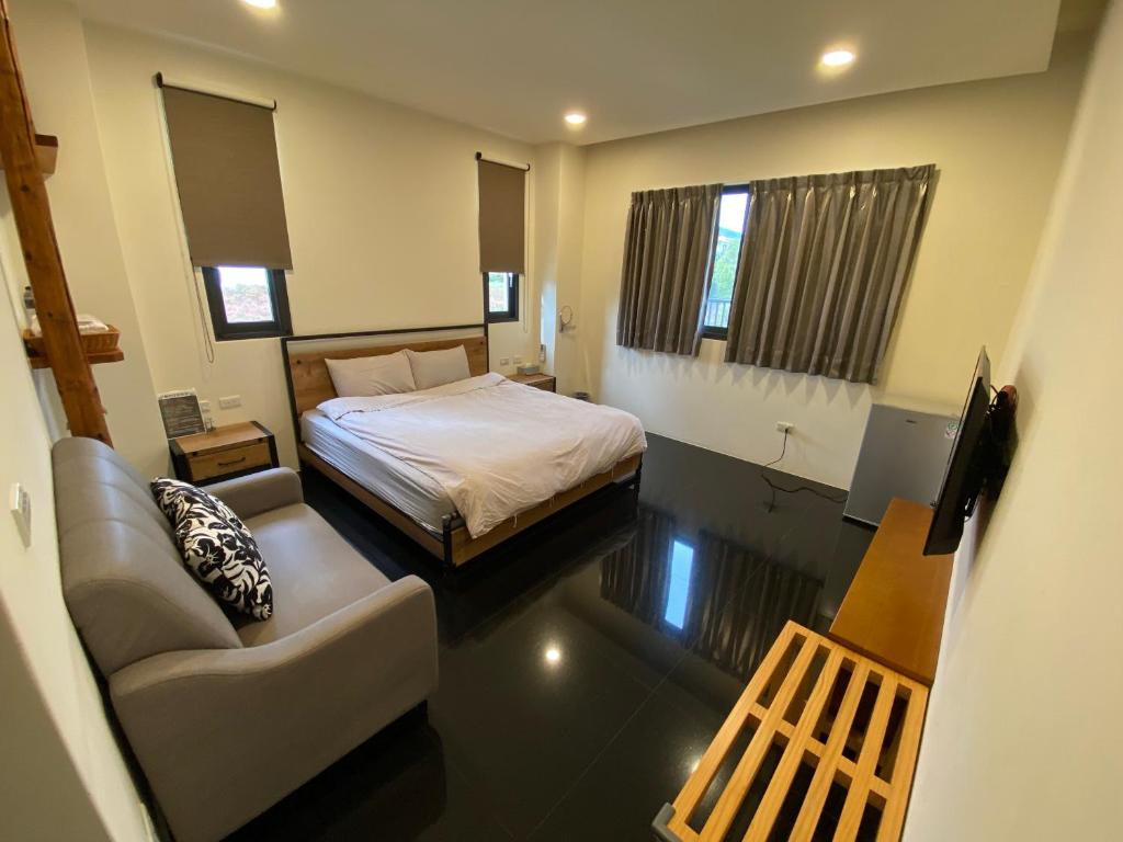 Postel nebo postele na pokoji v ubytování 晨民宿 Morning Homestay
