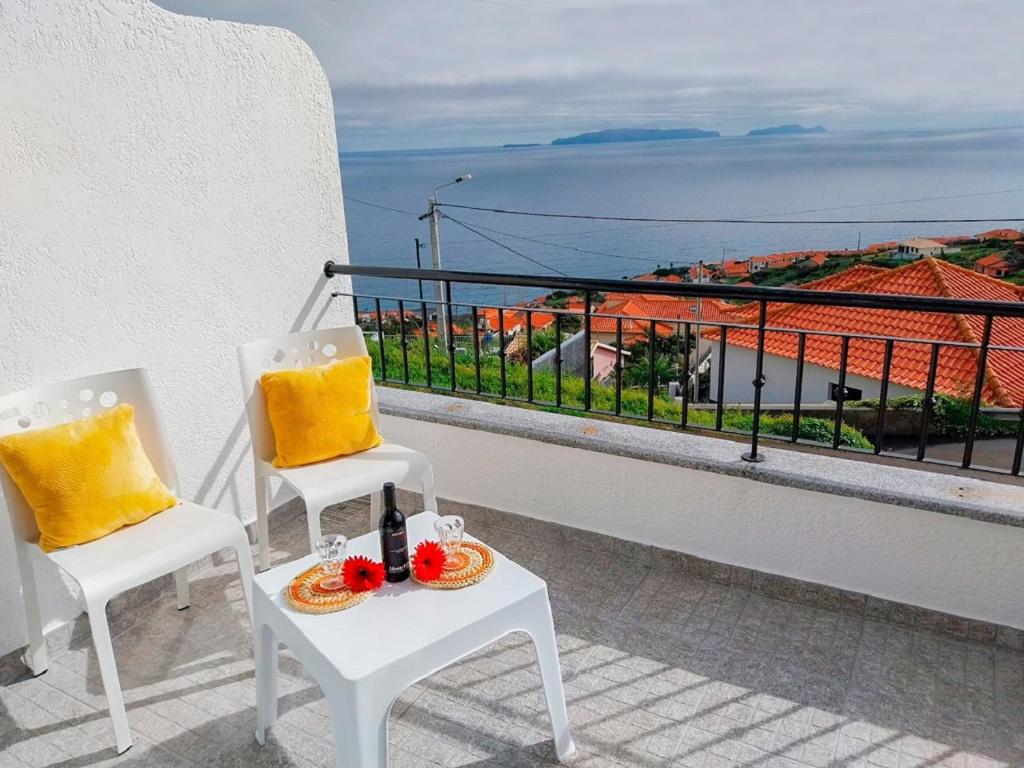a balcony with two chairs and a table with a view at Amazing View in Gaula