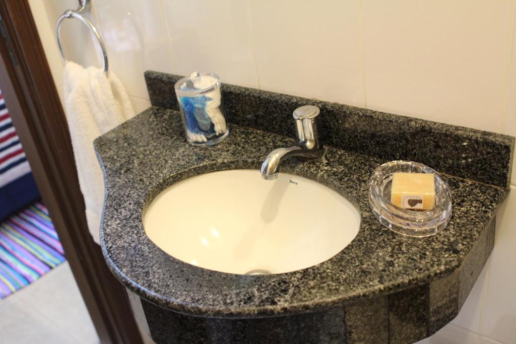 Koupelna v ubytování OKE Apart Hotel