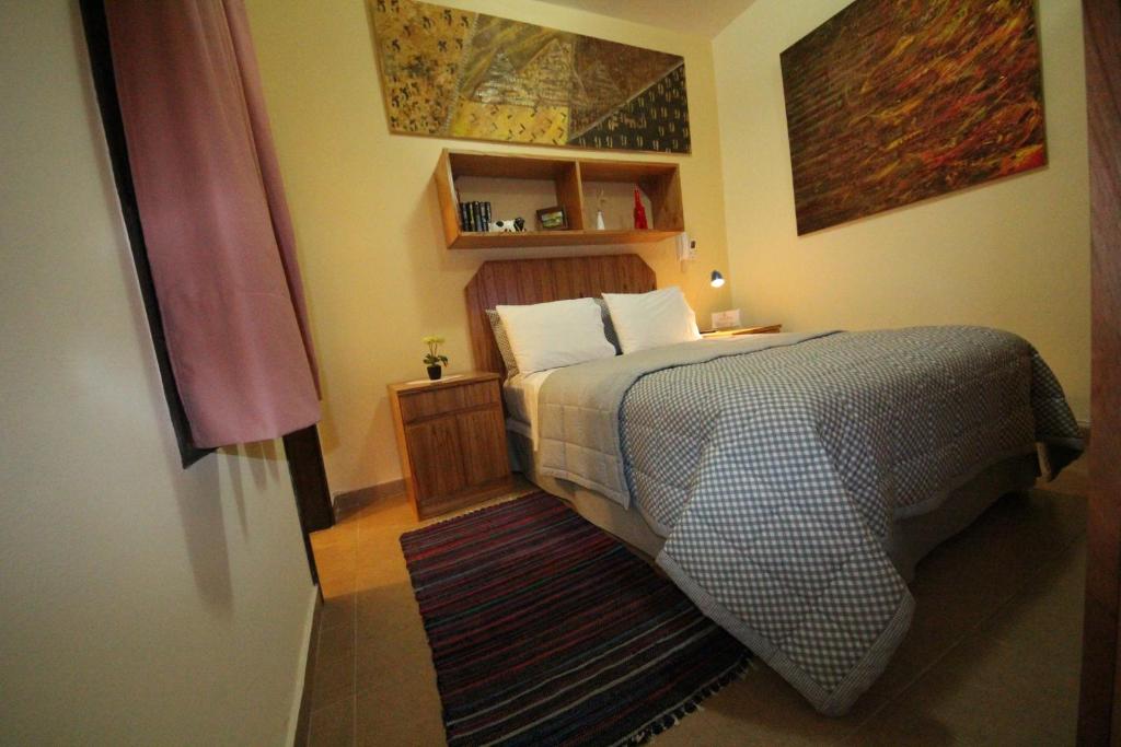 Postel nebo postele na pokoji v ubytování OKE Apart Hotel
