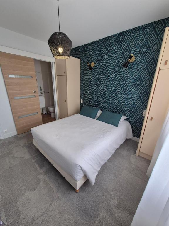 Postel nebo postele na pokoji v ubytování Hôtel l'Albatros
