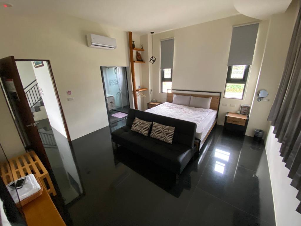 Postel nebo postele na pokoji v ubytování 晨民宿 Morning Homestay