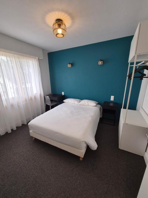 Postel nebo postele na pokoji v ubytování Hôtel l'Albatros