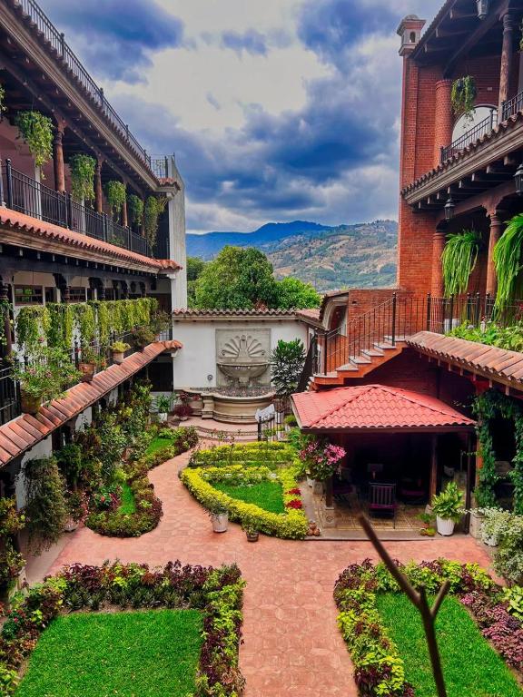 a courtyard of a building with a garden at La Casona de Ciudad Vieja in Ciudad Vieja