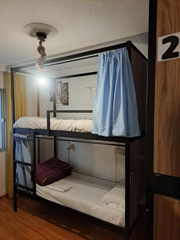Posteľ alebo postele v izbe v ubytovaní Hostel El Cascabel