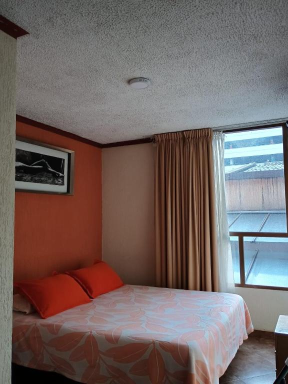 Postel nebo postele na pokoji v ubytování Hoteles Bogotá Inn Galerías