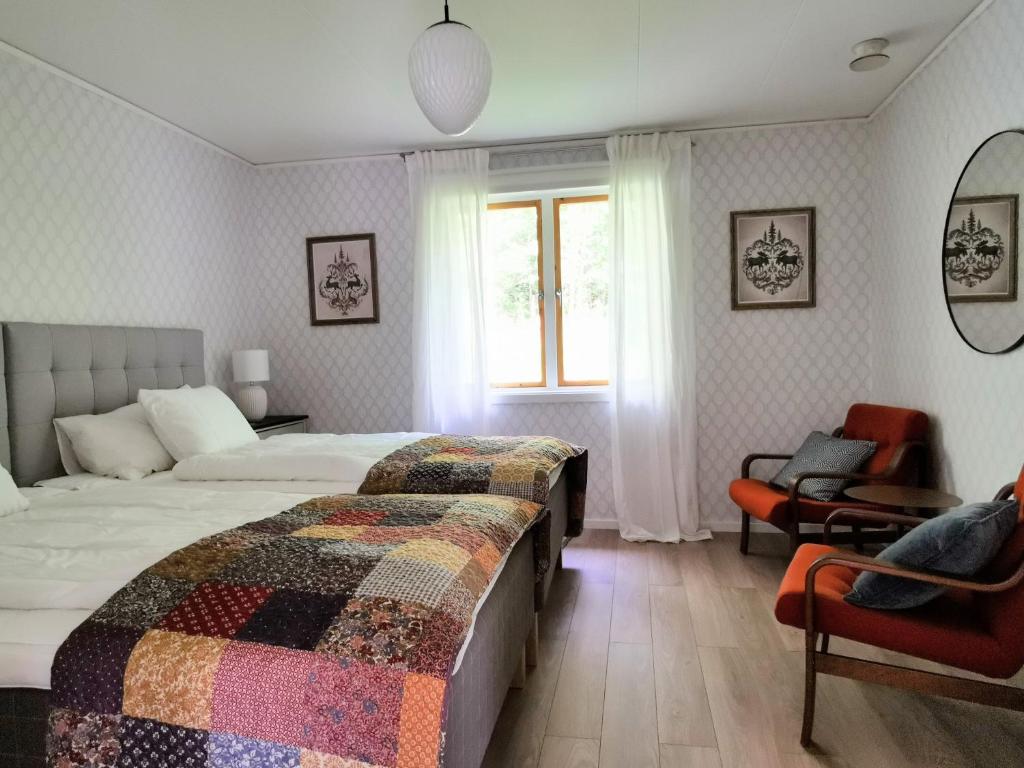 Postel nebo postele na pokoji v ubytování Jojos Lodge