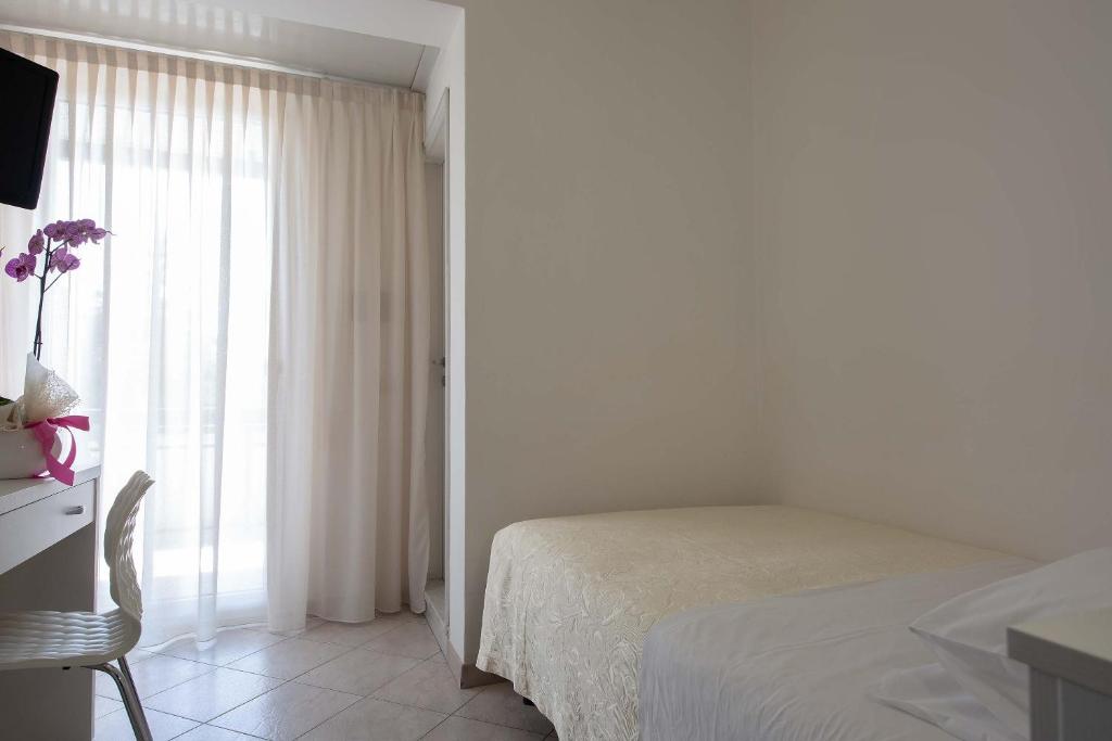 Postel nebo postele na pokoji v ubytování Hotel Sole