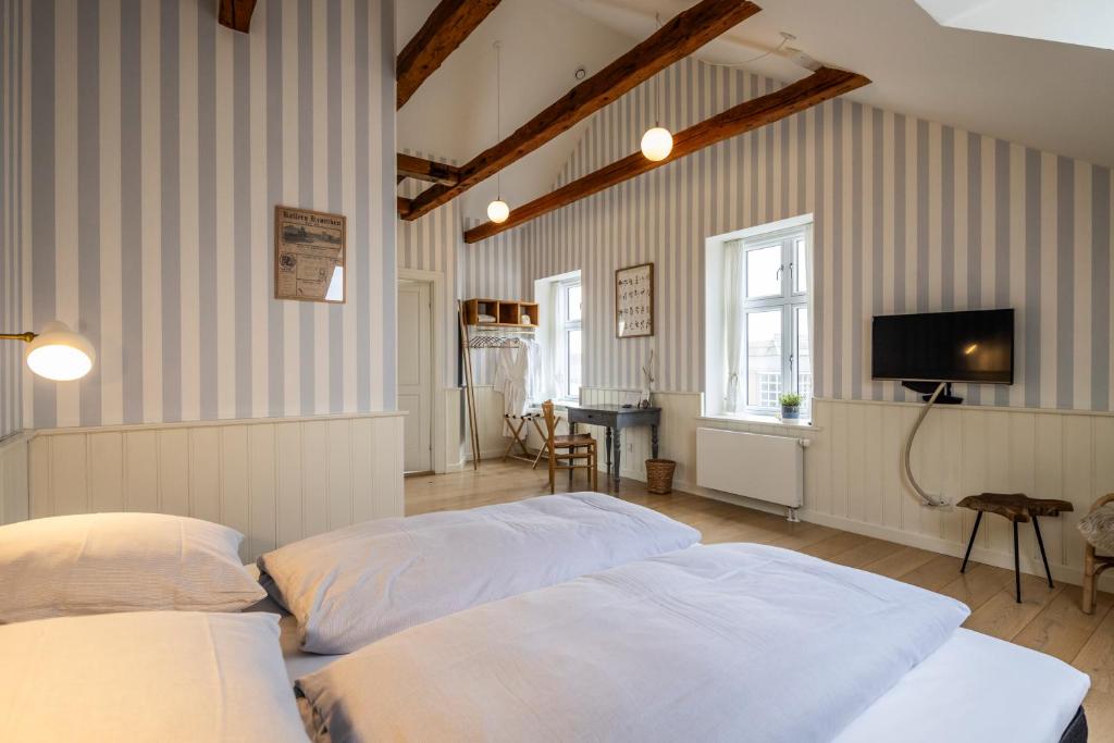 Postel nebo postele na pokoji v ubytování Kellers Badehotel